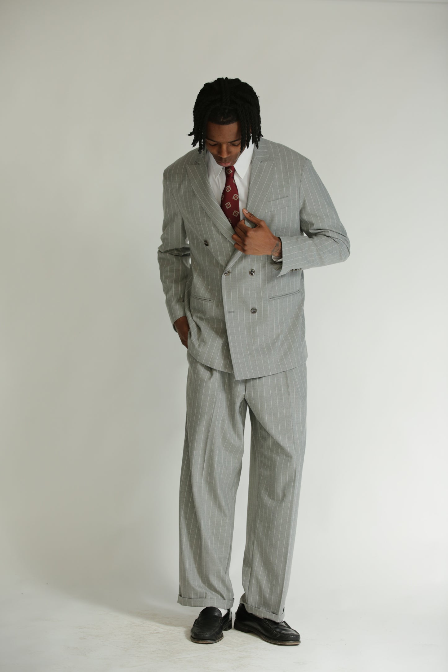 Pantalone vita alta fondo largo gessato grigio