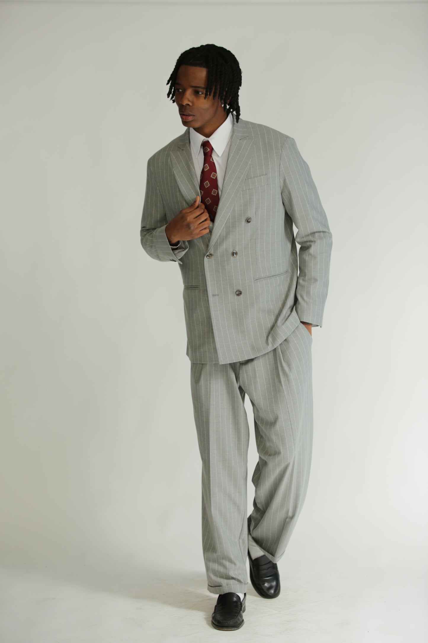 Pantalone vita alta fondo largo gessato grigio