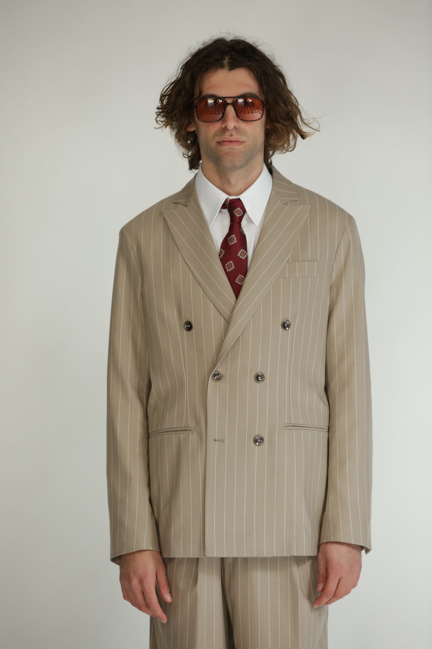 Pantalone vita alta fondo largo gessato beige