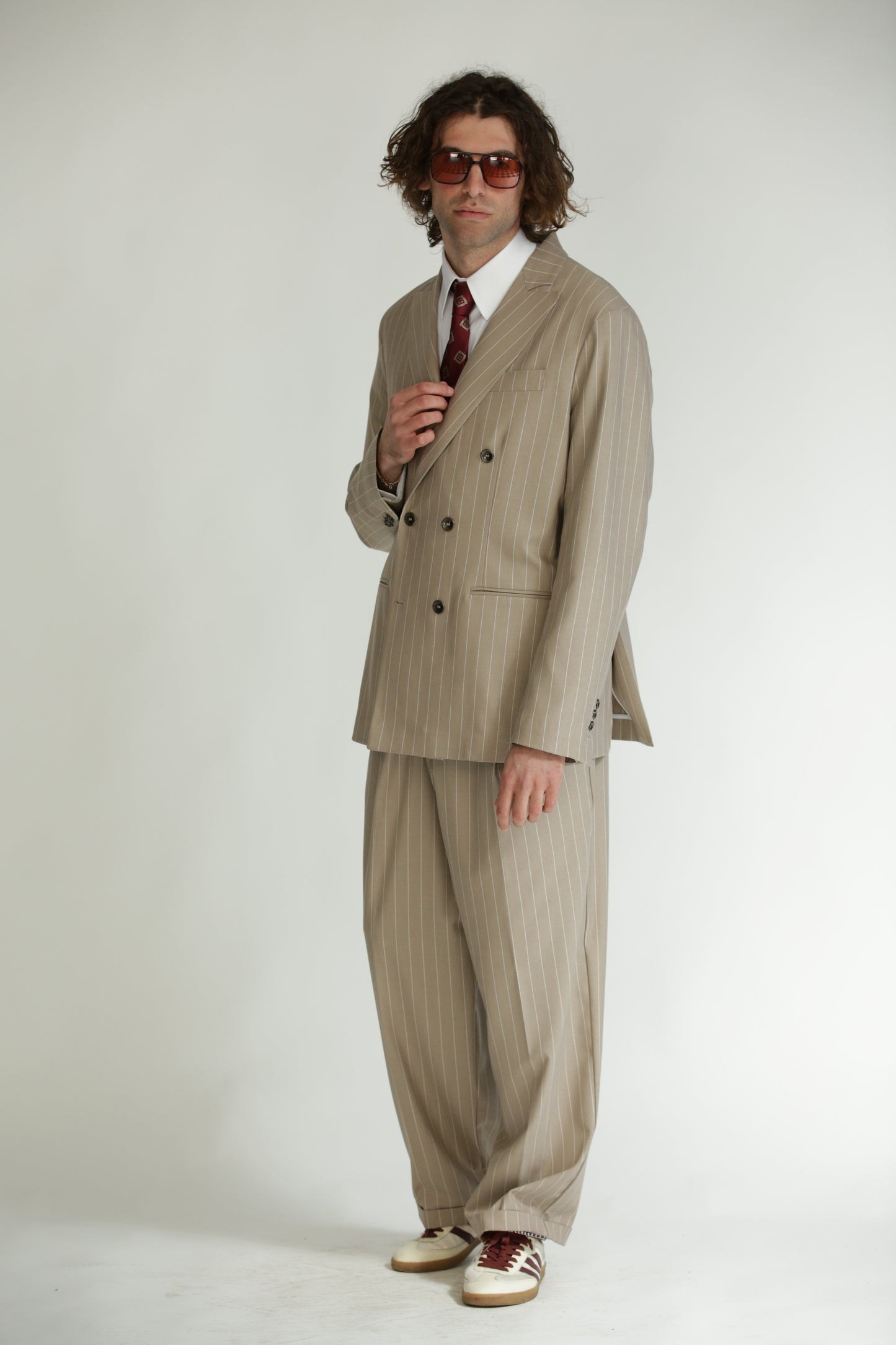 Pantalone vita alta fondo largo gessato beige