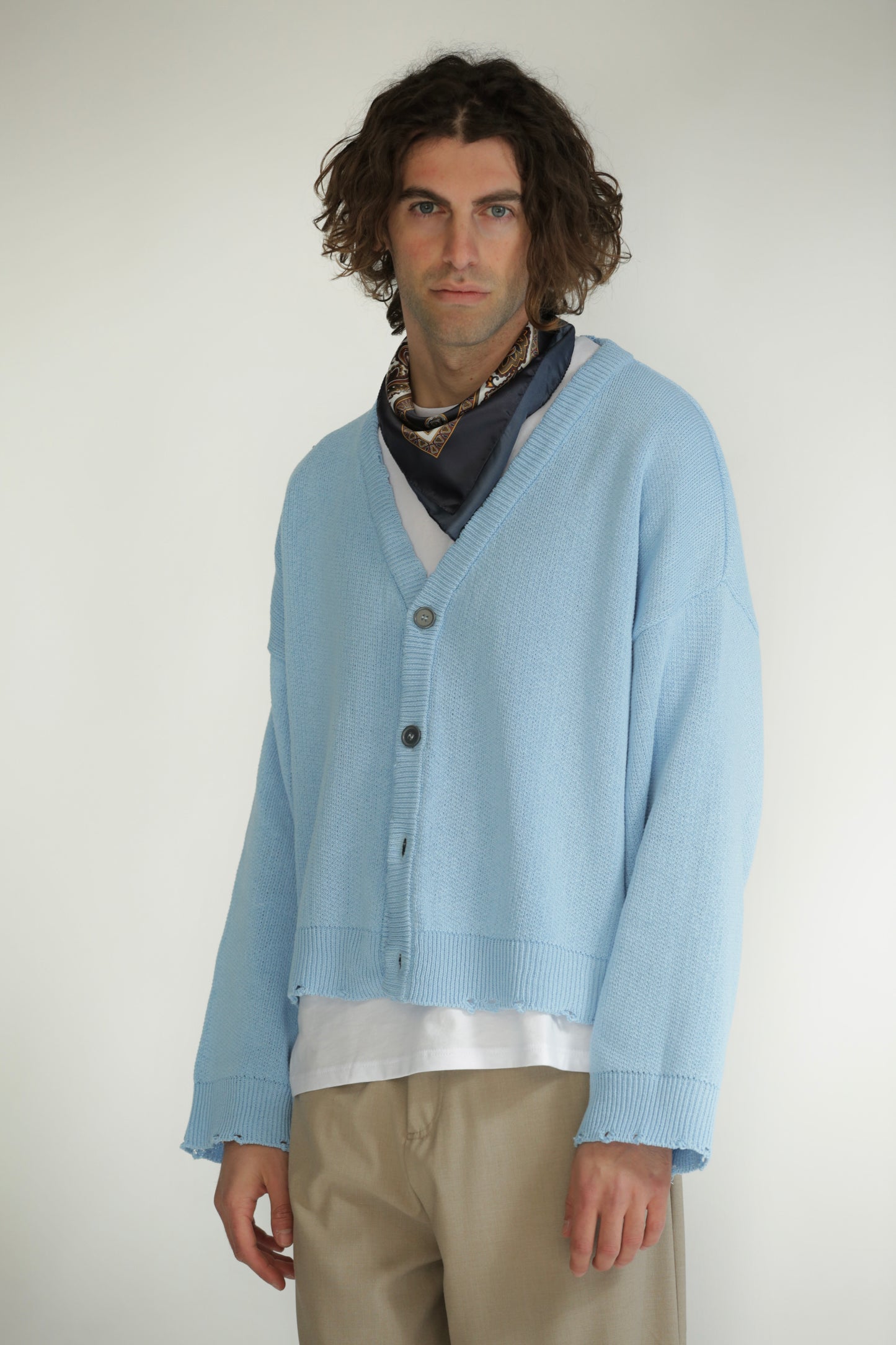 Cardigan crop taglio vivo celeste