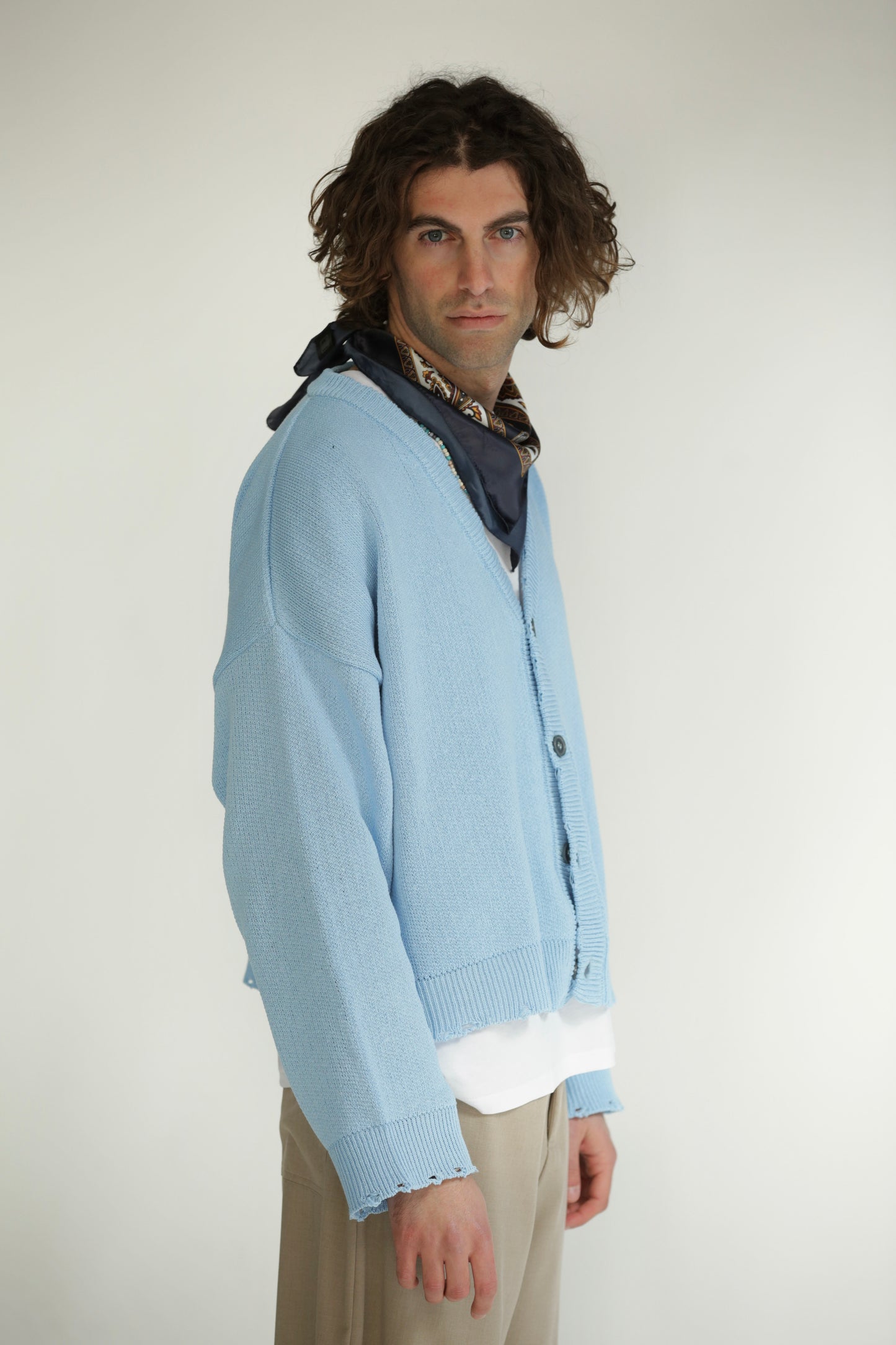 Cardigan crop taglio vivo celeste