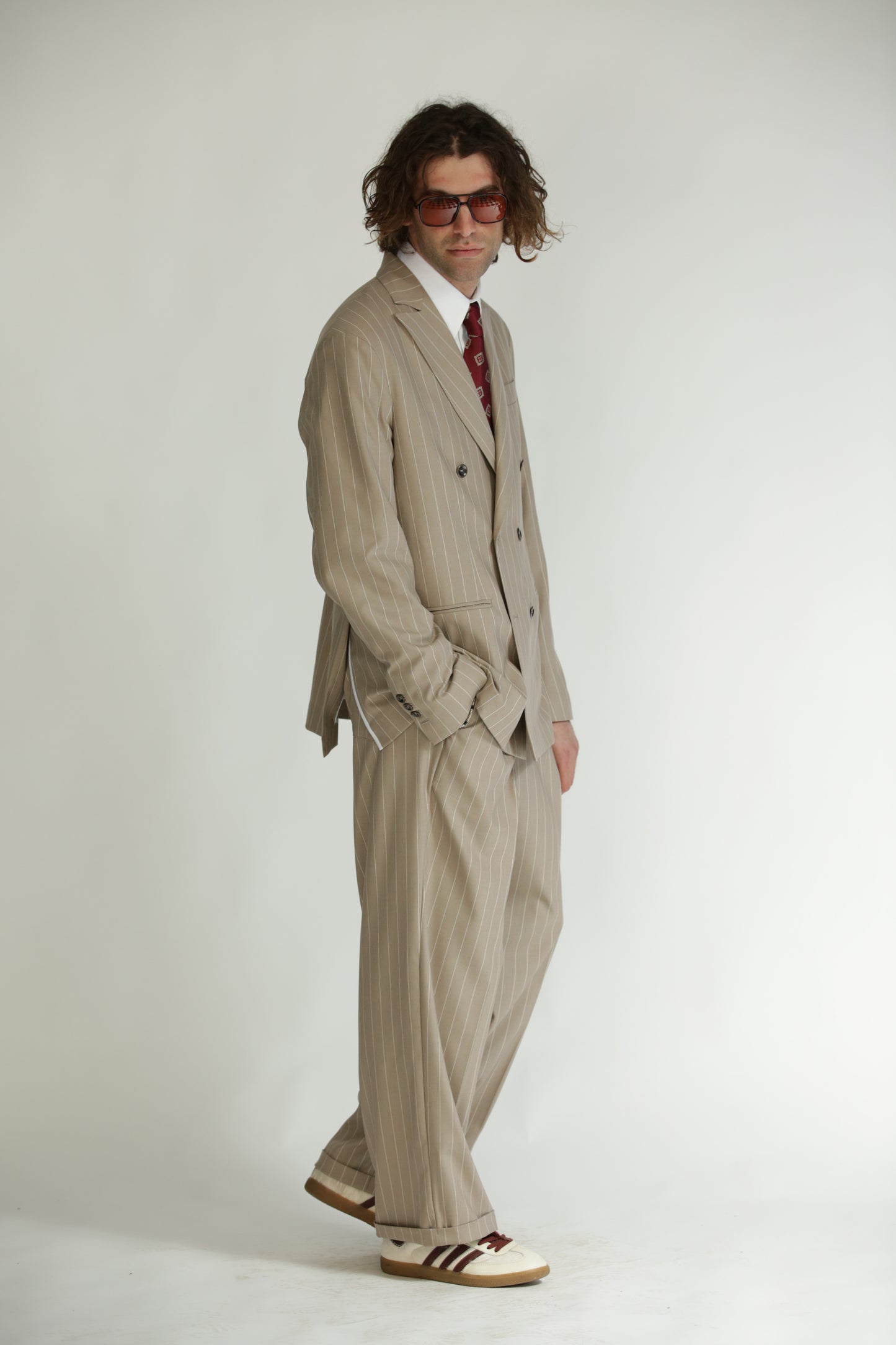 Pantalone vita alta fondo largo gessato beige